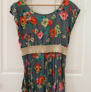 Floral dress with open back and pockets.